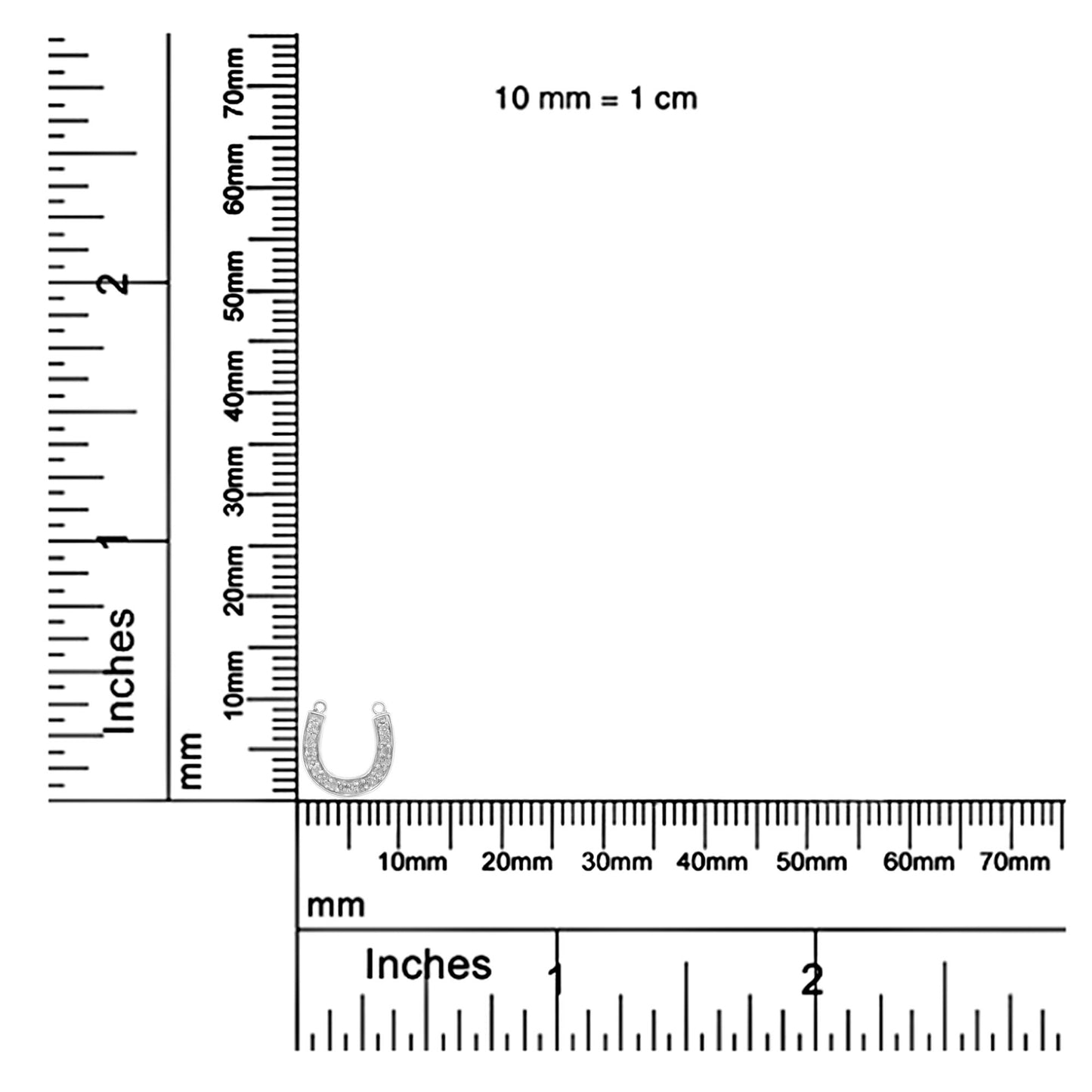 White metal horseshoe-shaped necklace pendant with round white gemstones in pave setting, shown on rulers for size reference, front angle.