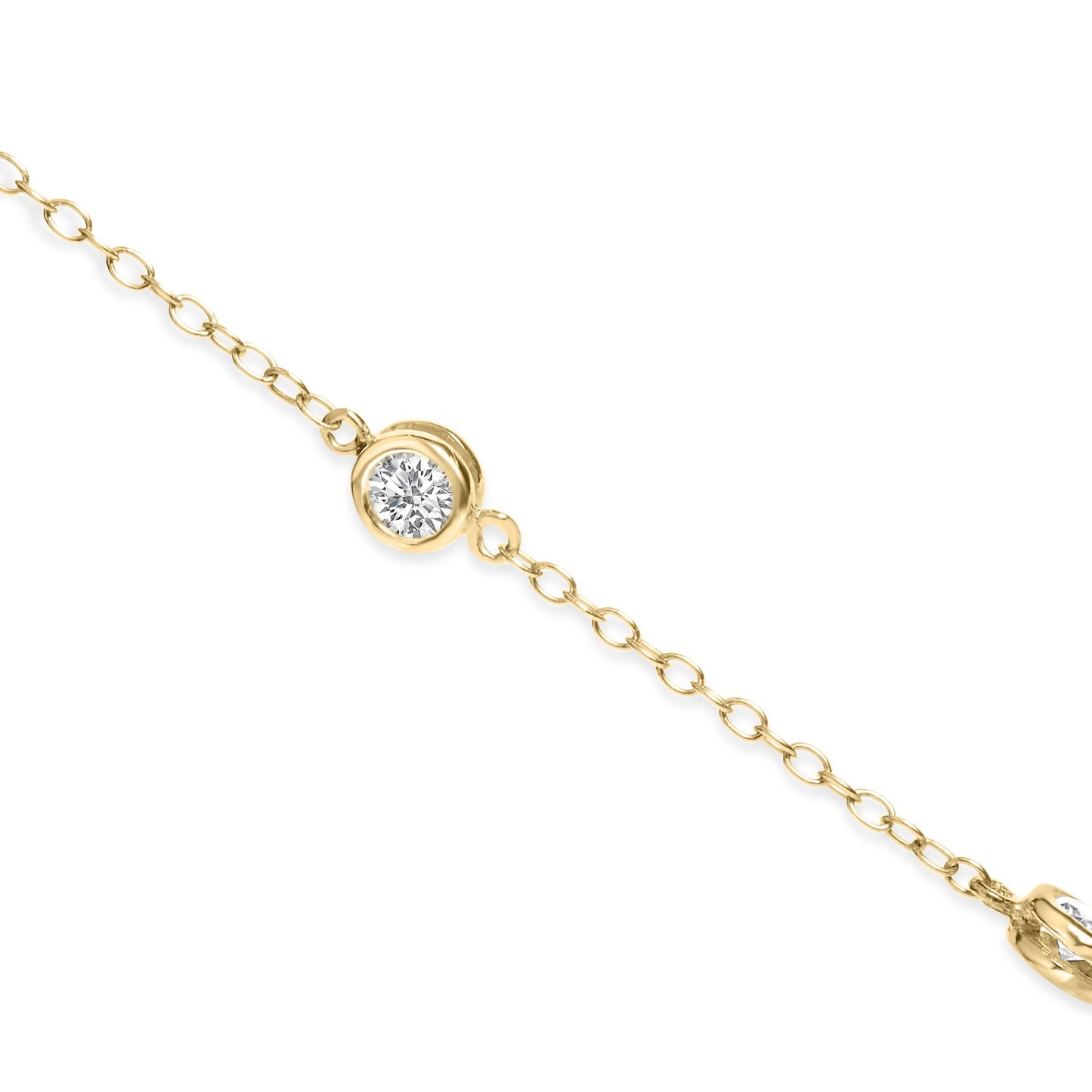 Close-up front angle of a yellow metal necklace chain featuring a round white gemstone in a bezel setting.