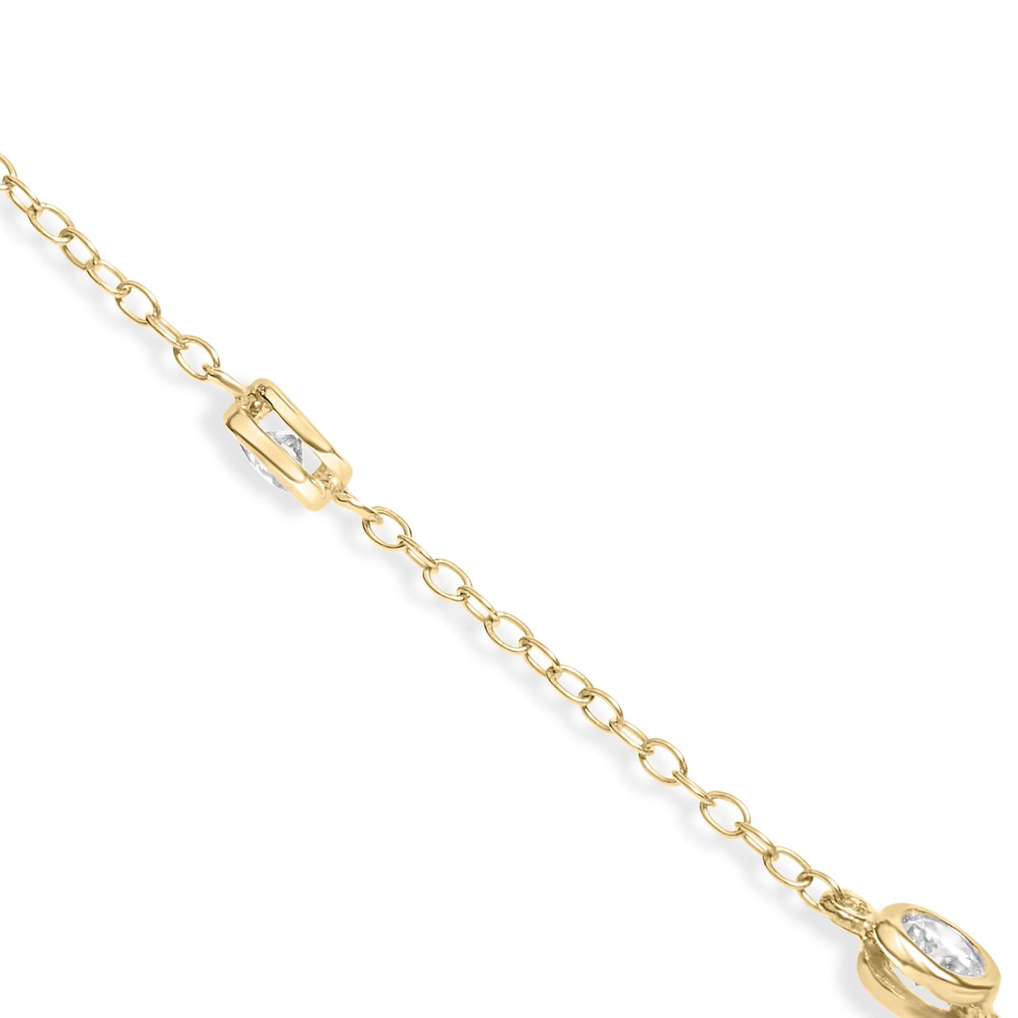 Close-up angled view of a yellow metal necklace chain featuring round white gemstones in bezel settings.