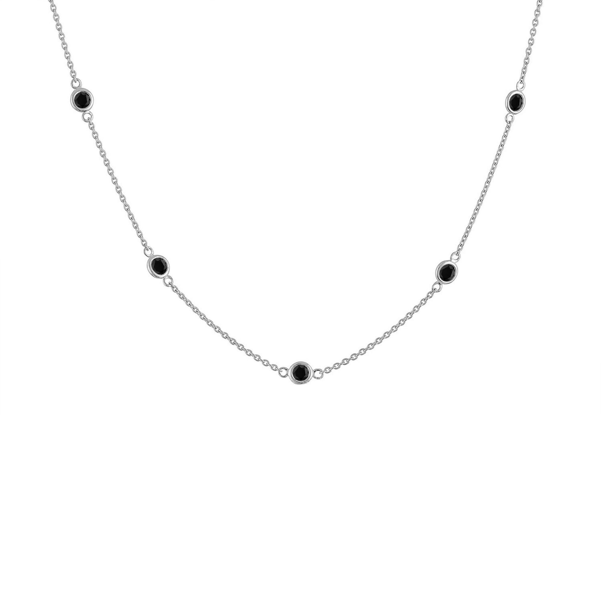 White metal necklace with round black gemstones in bezel settings evenly spaced along the chain, shown in a front-facing angle.