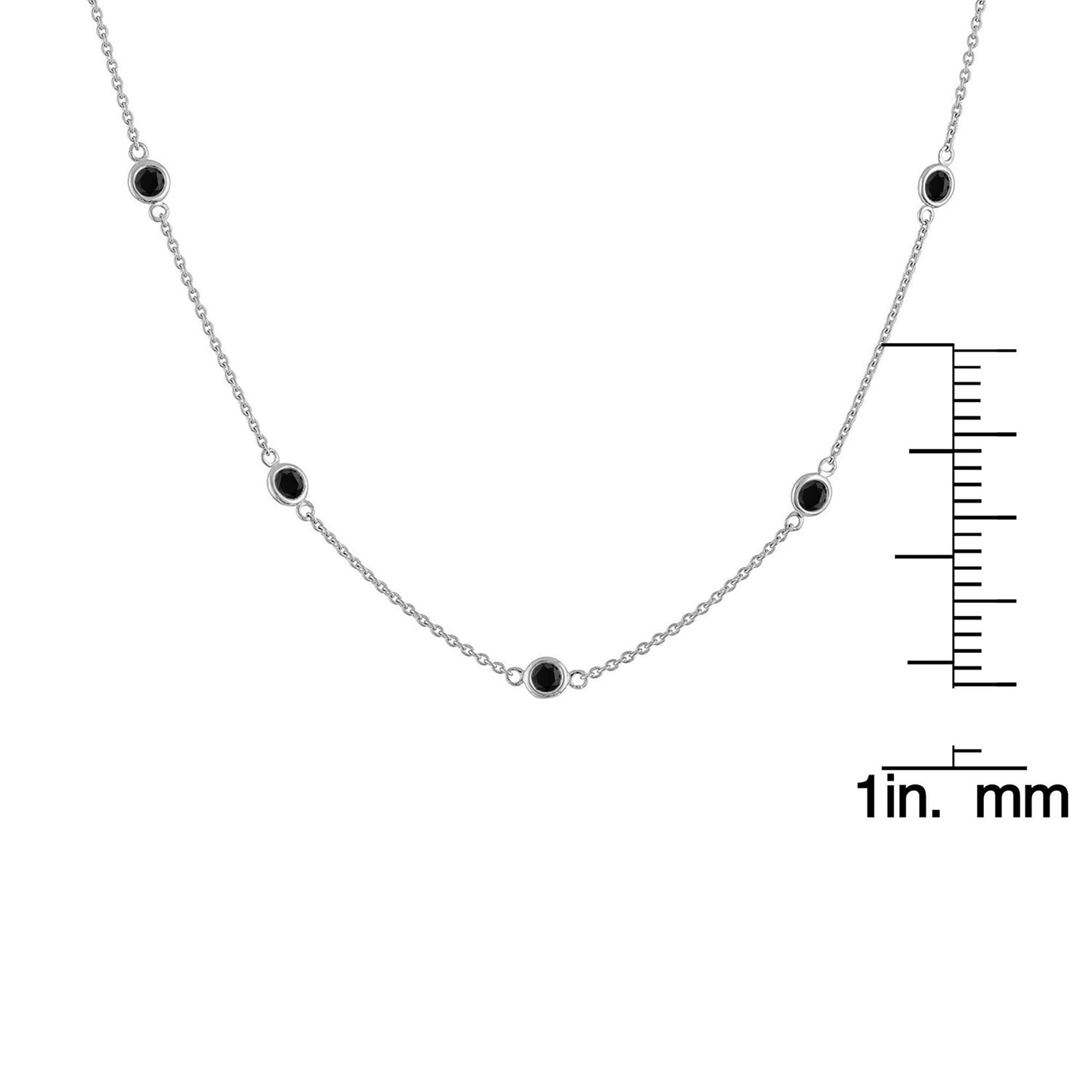 Front view of white metal necklace with round black gemstones in bezel settings, displayed on a ruler for size reference.