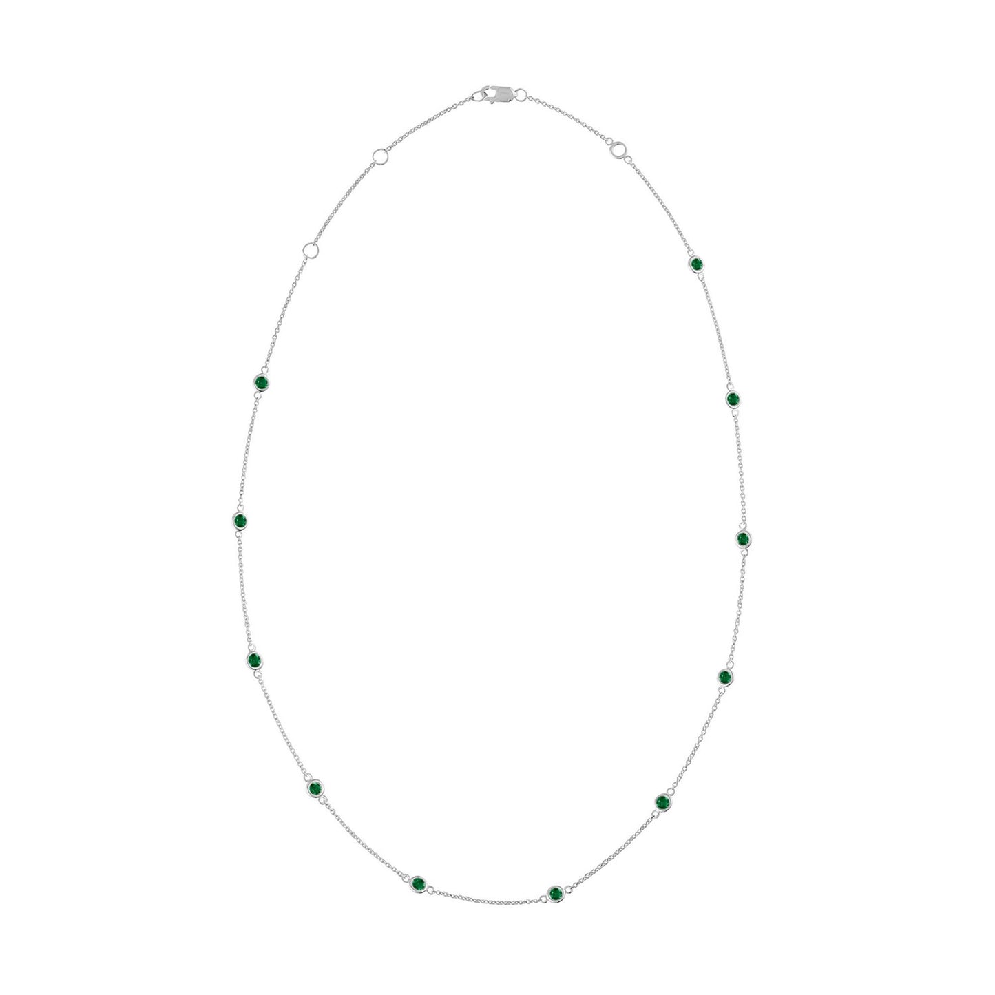 White necklace with bezel-set round green gemstones evenly spaced along the chain, shown against a white background from a top-down angle.