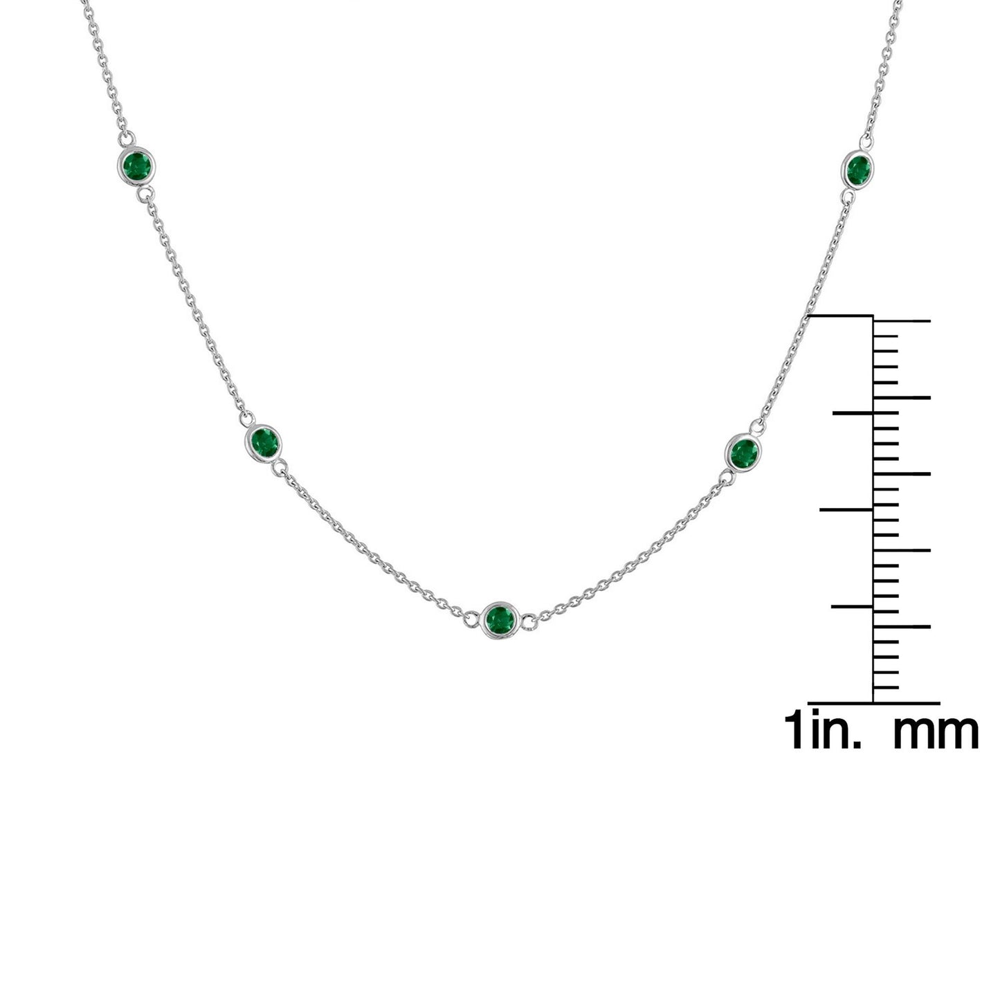 Front view of a white metal necklace with round bezel-set green gemstones, displayed with a ruler for size reference.