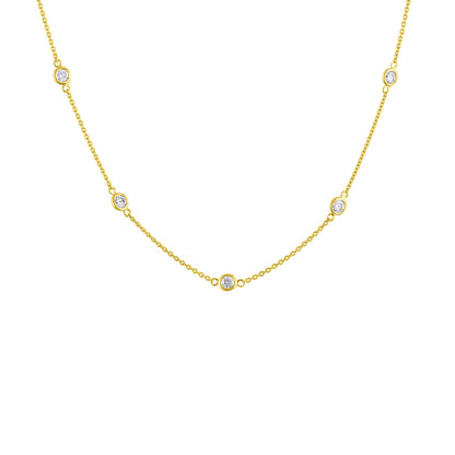 Yellow metal necklace with round white gemstones in bezel settings evenly spaced along the chain, shown in a front-facing close-up angle.