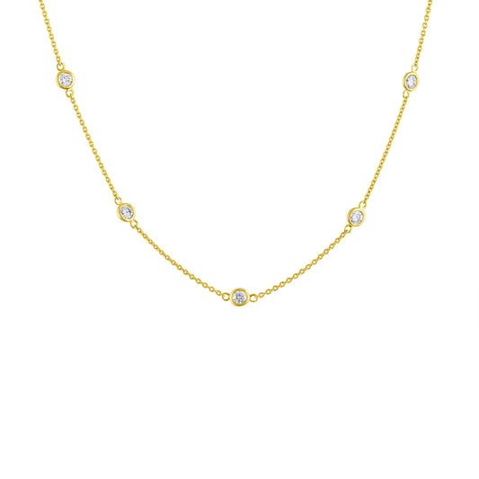 Yellow metal necklace with round white gemstones in bezel settings evenly spaced along the chain, shown in a front-facing close-up angle.