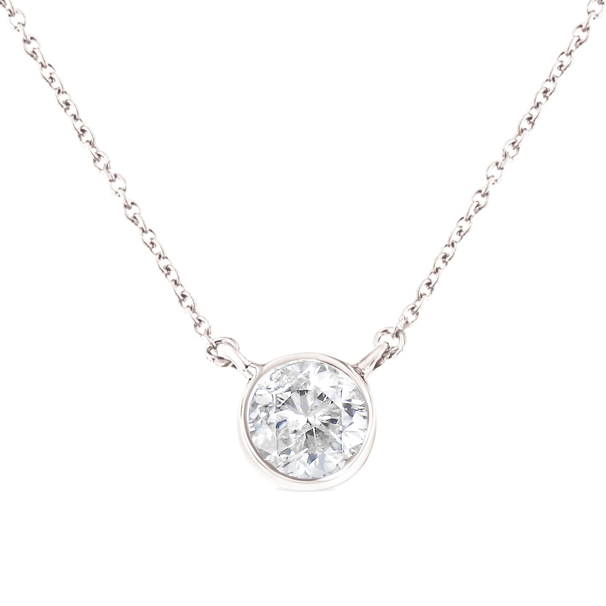 Close-up front view of white metal necklace with a round white gemstone in a bezel setting centered on the chain.