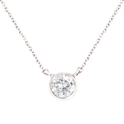 Close-up front view of white metal necklace with a round white gemstone in a bezel setting centered on the chain.