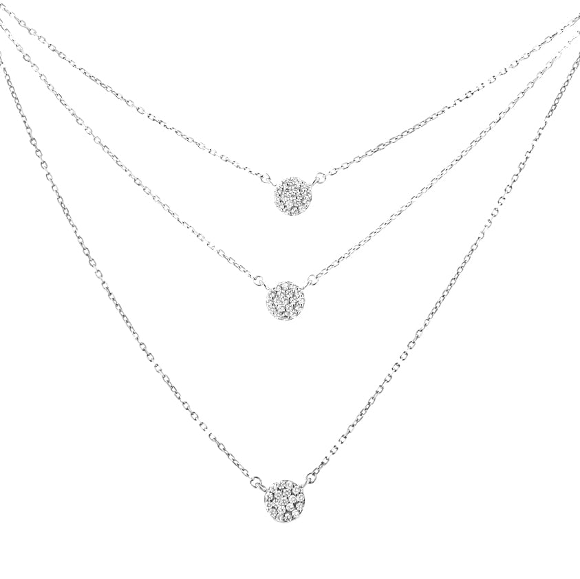 Front view of three layered white metal necklaces, each featuring a small round cluster of white gemstones in prong settings at the center.