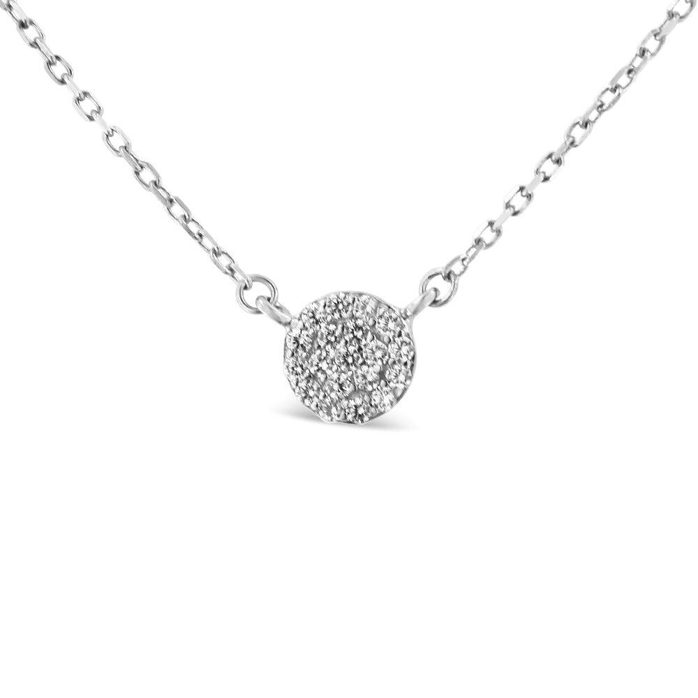 Close-up front view of a white metal necklace with a round pendant encrusted with multiple small white gemstones in prong settings.