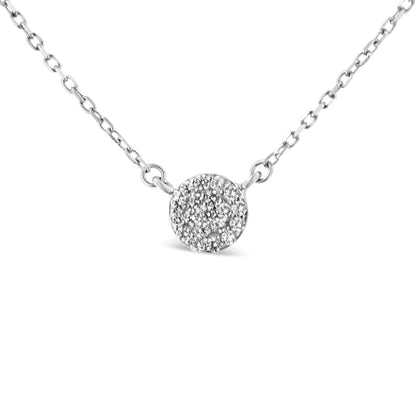 Close-up front view of a white metal necklace with a round pendant encrusted with multiple small white gemstones in prong settings.