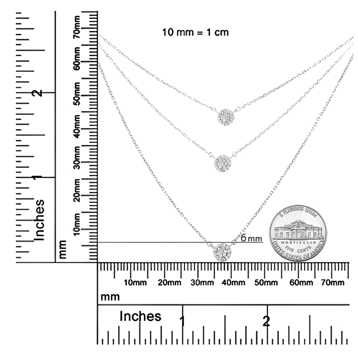 Top-down shot of three white metal necklaces with round-shaped white gemstones in prong settings, displayed on a ruler and a coin for size reference.