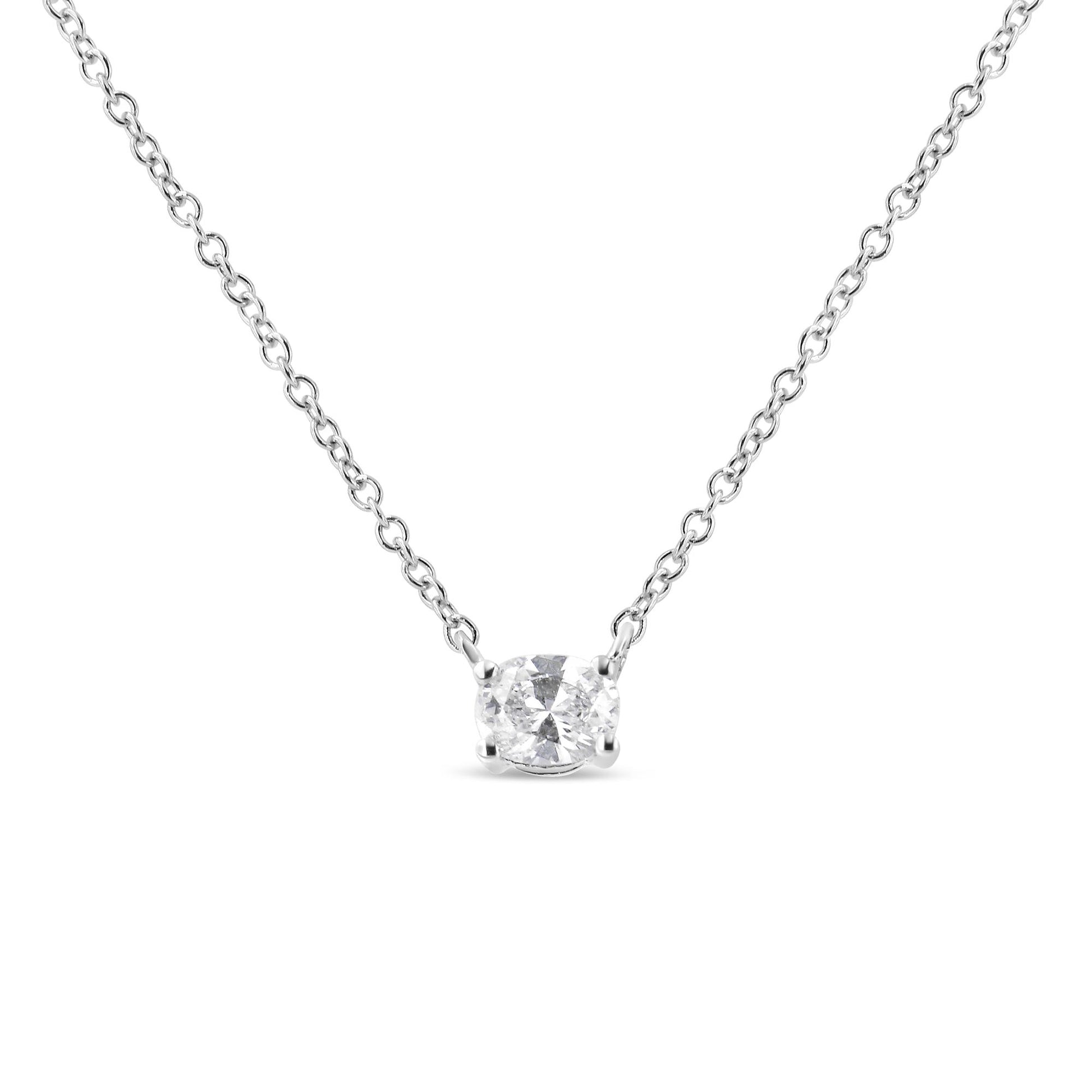 Front view of a white metal necklace with a single oval-shaped white gemstone in a four-prong setting.