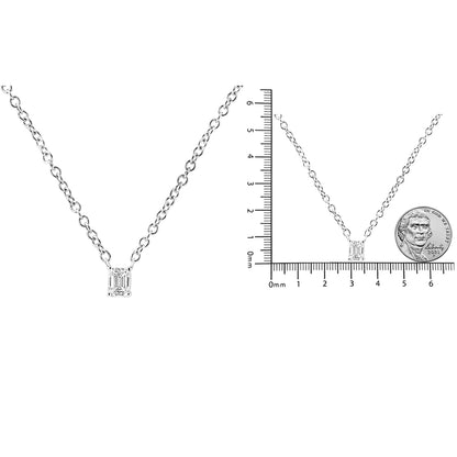 Two images of a white metal necklace with a single emerald-shaped white gemstone in a four-prong setting; one close-up front view and one front view on a ruler and next to a coin for size reference.