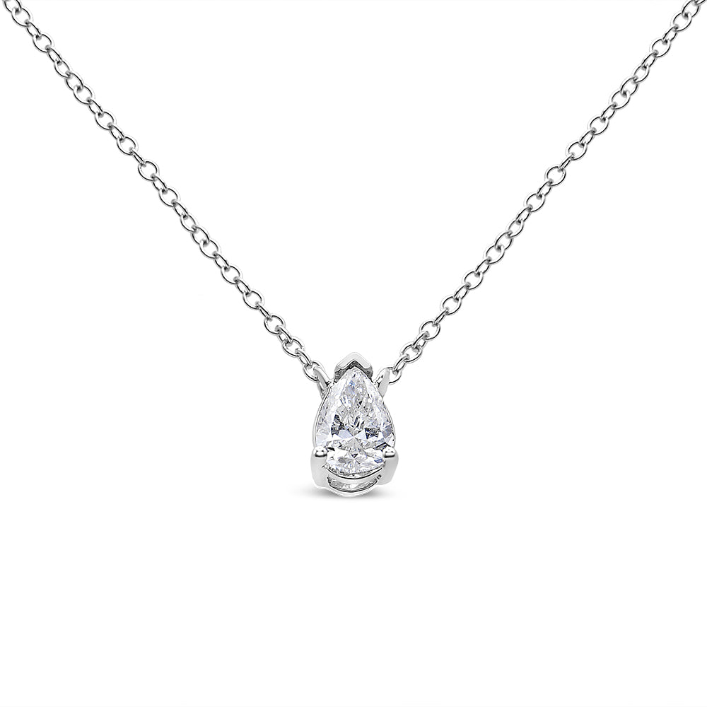 Front view of a white metal necklace with a pear-shaped white gemstone in a three-prong setting pendant.