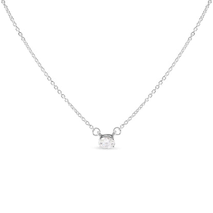 Front-facing shot of a white metal necklace featuring a single oval-shaped white gemstone in a four-prong setting.