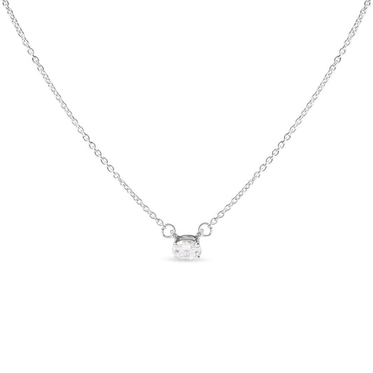 Front-facing shot of a white metal necklace featuring a single oval-shaped white gemstone in a four-prong setting.