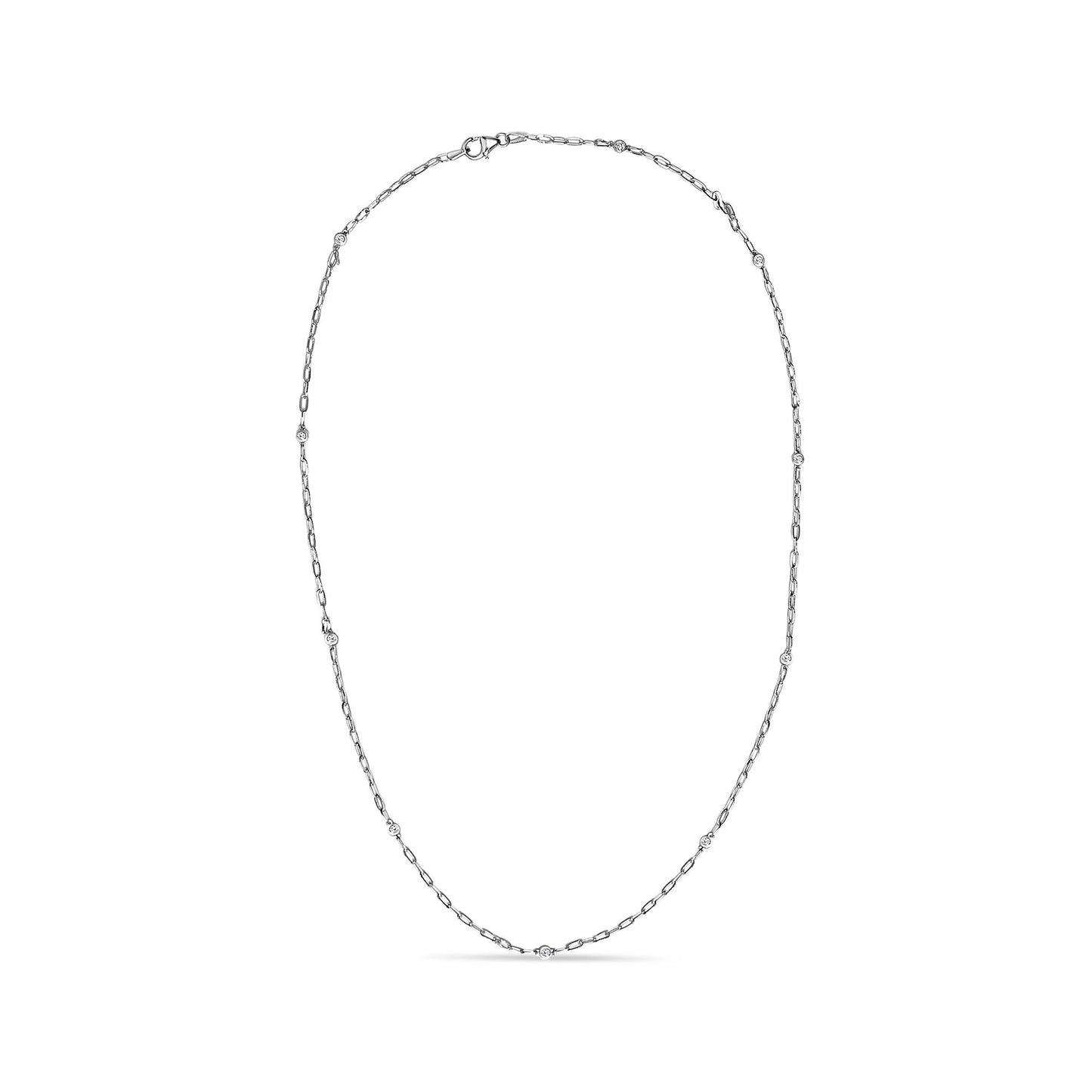 White metal necklace with a delicate link chain featuring round white gemstones in bezel settings evenly spaced, shown flat on a white background from a top-down angle.