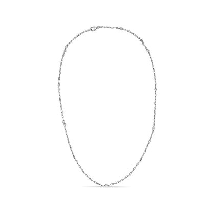 White metal necklace with a delicate link chain featuring round white gemstones in bezel settings evenly spaced, shown flat on a white background from a top-down angle.