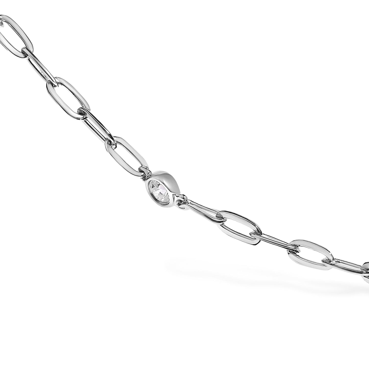 Close-up angled shot of a white metal necklace featuring a chain link design with a single round white gemstone in a bezel setting.