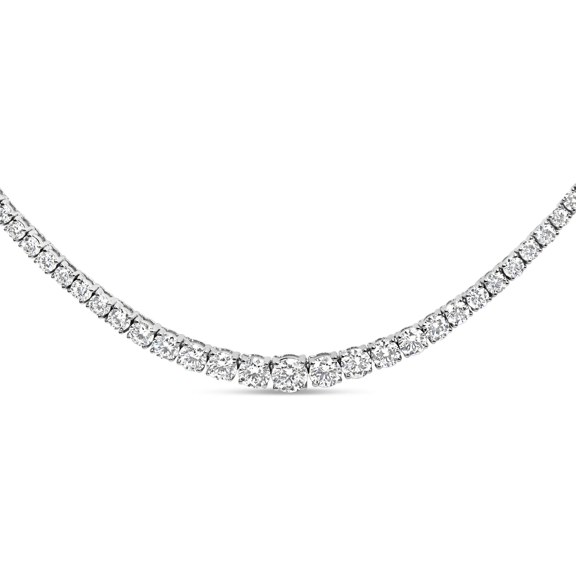 Close-up front angle of a white metal necklace featuring a continuous row of round white gemstones in four-prong settings.