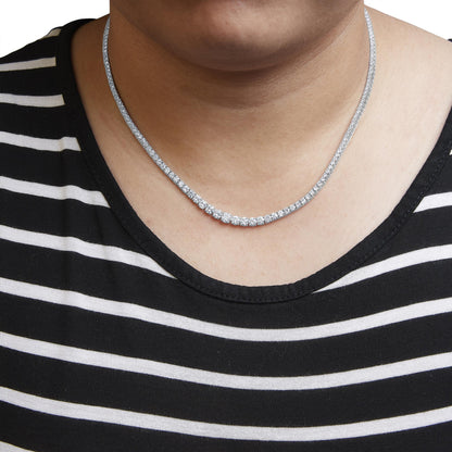 White necklace with multiple white gemstones in four-prong settings, worn on a model, front-facing close-up angle.