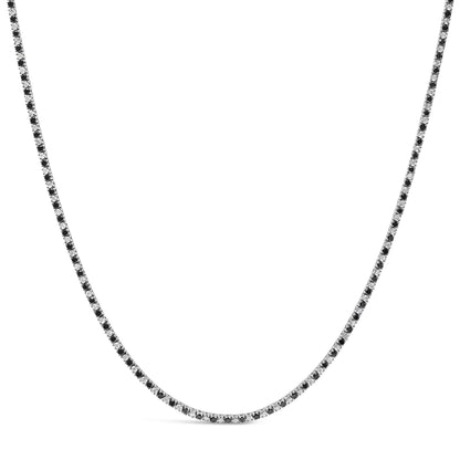 White metal necklace with alternating black and white round gemstones in 4-prong settings, shown against a white background from a front angle.