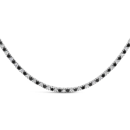 Close-up front view of a white necklace featuring alternating round white and black gemstones in a four-prong setting.