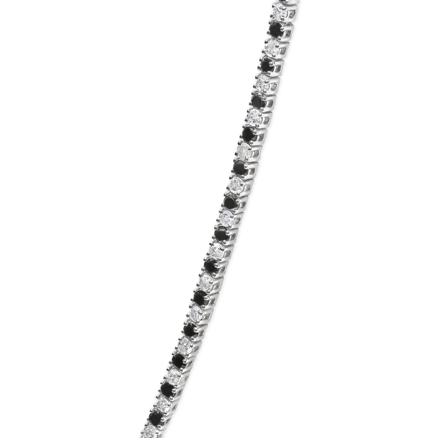 Close-up front angle of a white metal necklace featuring alternating round white and black gemstones in 4-prong settings.