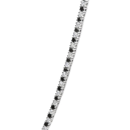 Close-up front angle of a white metal necklace featuring alternating round white and black gemstones in 4-prong settings.