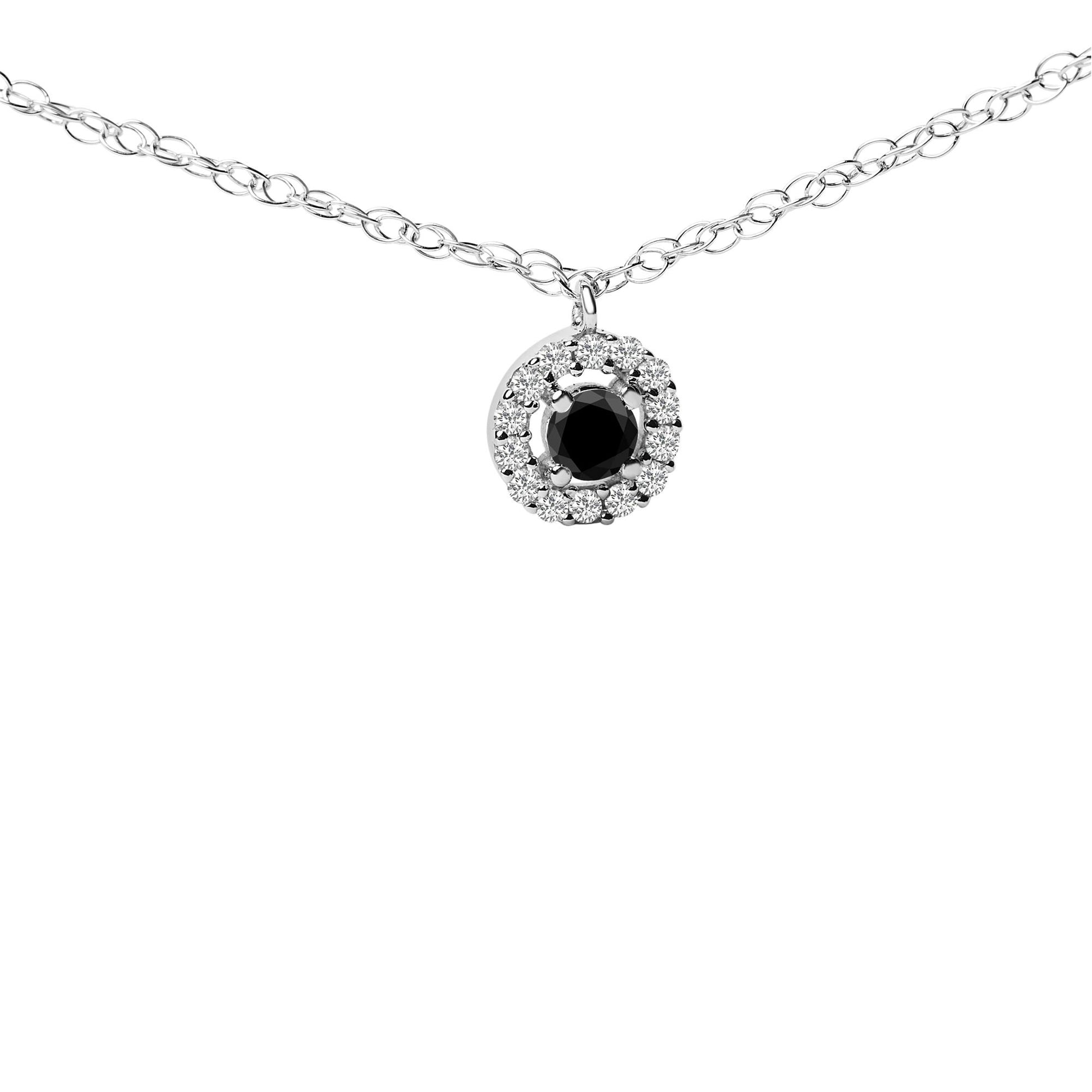 Close-up front angle of a white metal necklace with a pendant featuring a round black gemstone surrounded by a halo of white gemstones, shown on a white background.