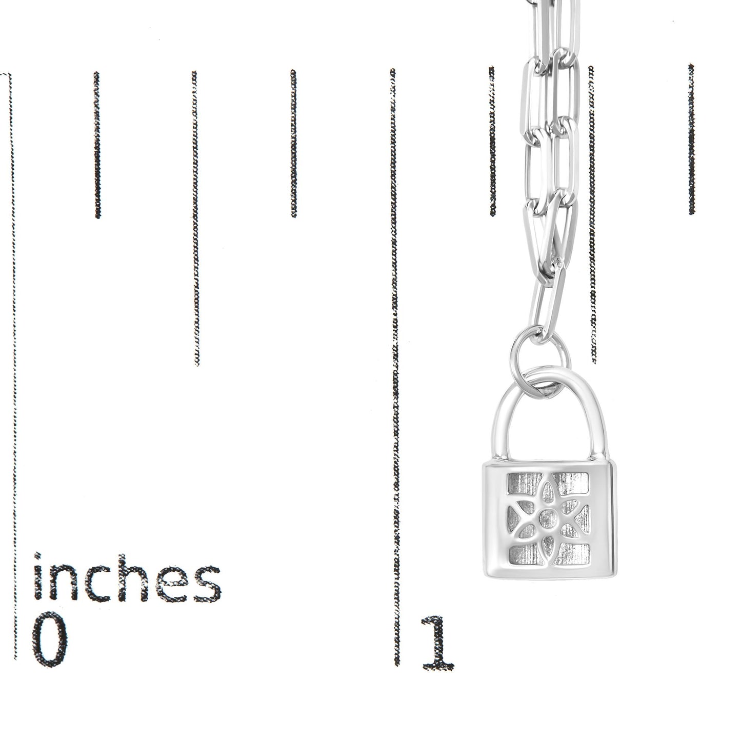 Close-up front angle of a white metal necklace with a padlock pendant featuring a floral design accented with round white gemstones, shown on a ruler for size reference.