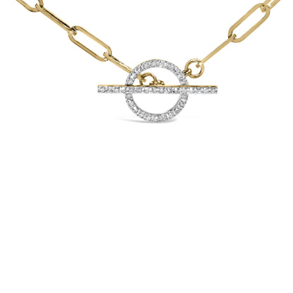 Close-up front view of a yellow metal necklace with a circular pendant and a horizontal bar, both adorned with white round gemstones in prong settings.