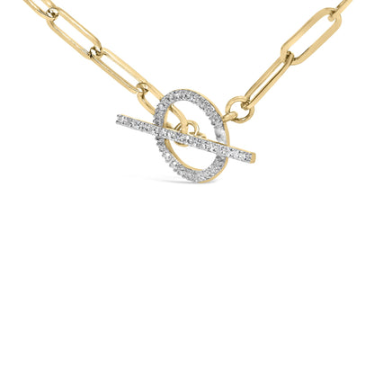 Close-up front angle of a yellow metal necklace with a toggle clasp adorned with white round gemstones in prong settings.