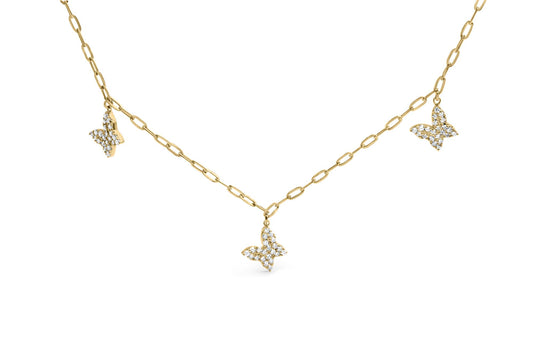 Yellow metal necklace with three butterfly-shaped pendants adorned with white round gemstones in prong settings, shown in a front-facing angle.