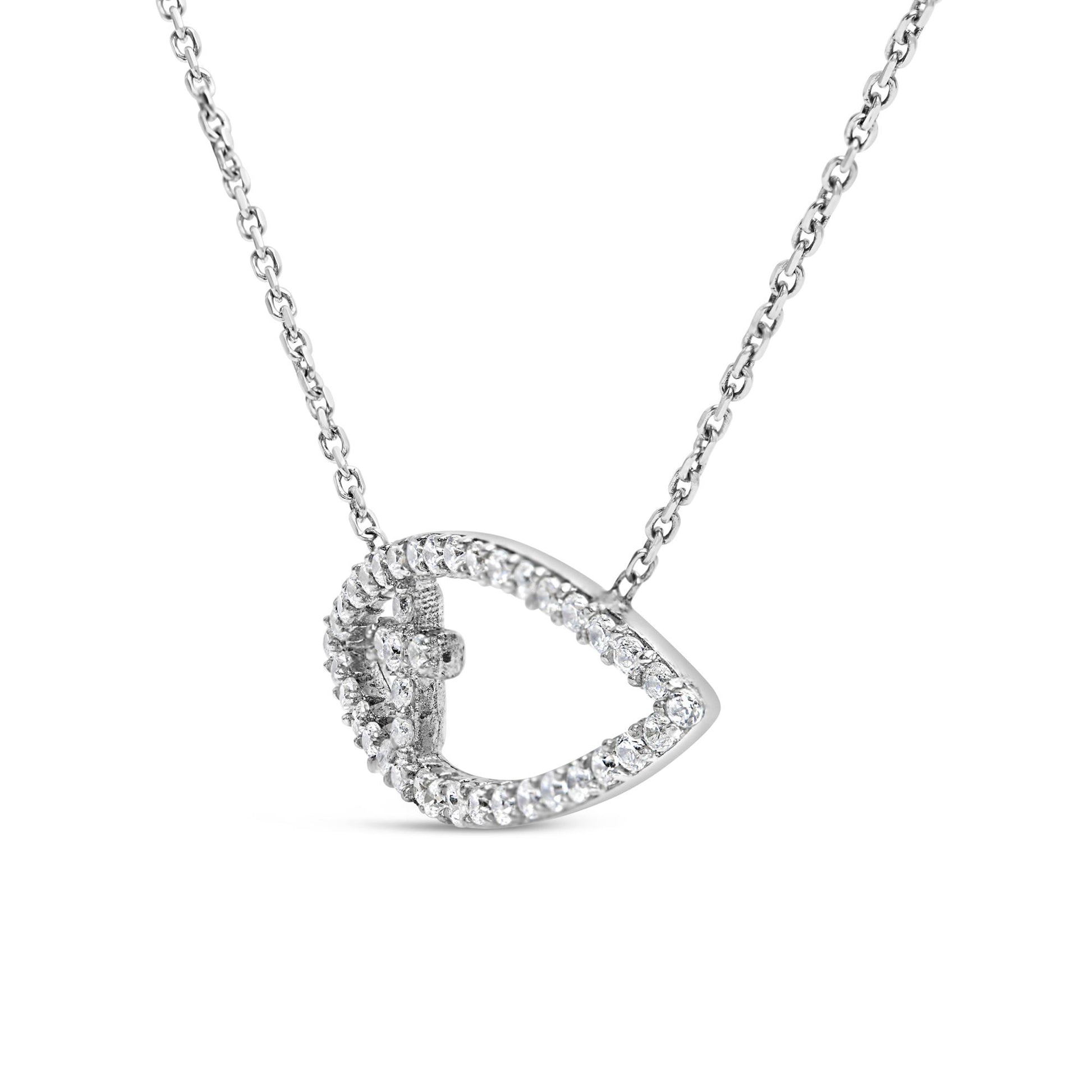 White metal necklace with a teardrop-shaped pendant adorned with round white gemstones in prong settings, photographed in a close-up frontal angle.