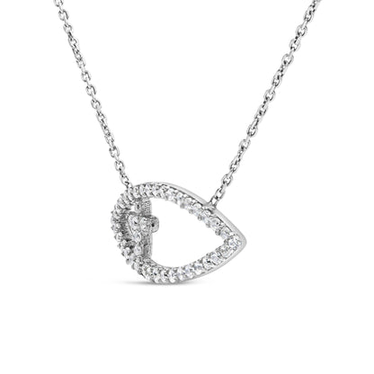White metal necklace with a teardrop-shaped pendant adorned with round white gemstones in prong settings, photographed in a close-up frontal angle.
