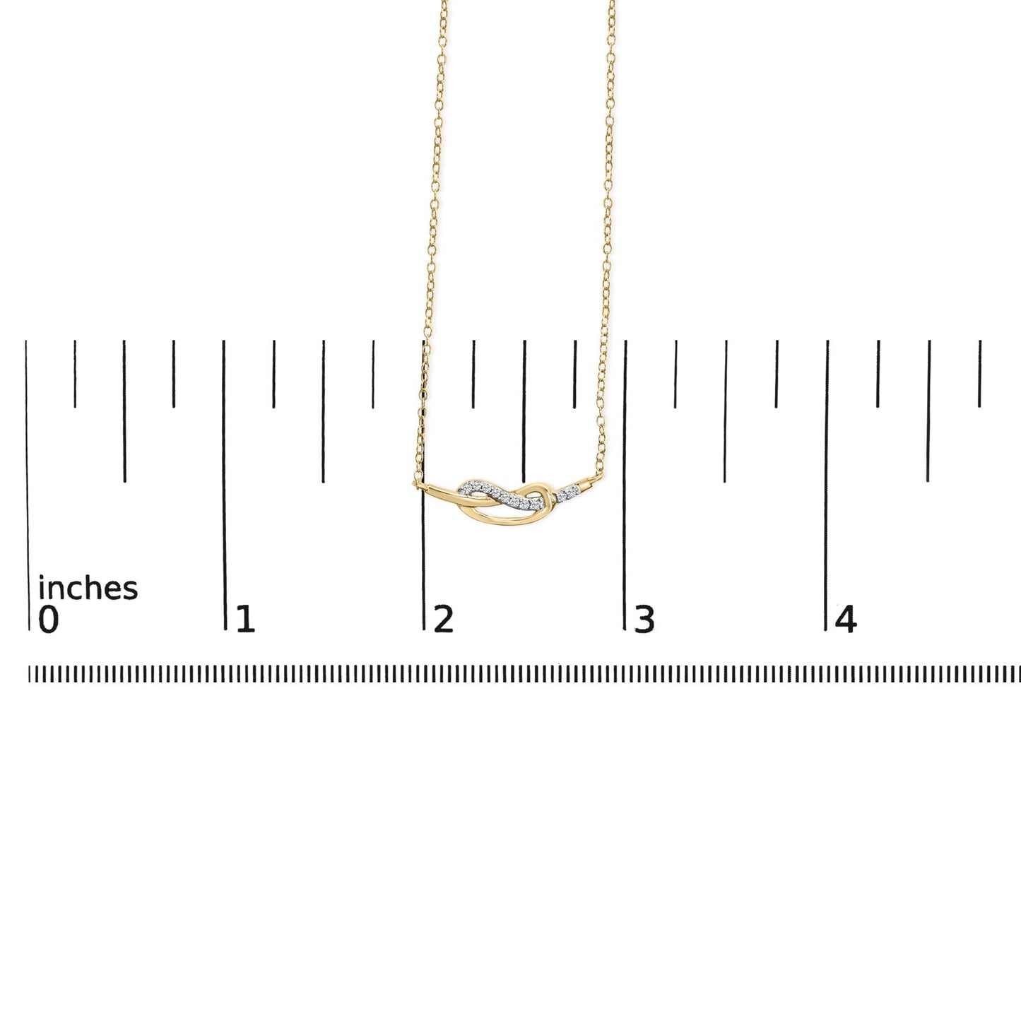 Yellow necklace with a curved knot pendant adorned with white round gemstones in prong settings, displayed on a ruler for size reference, front-facing angle.