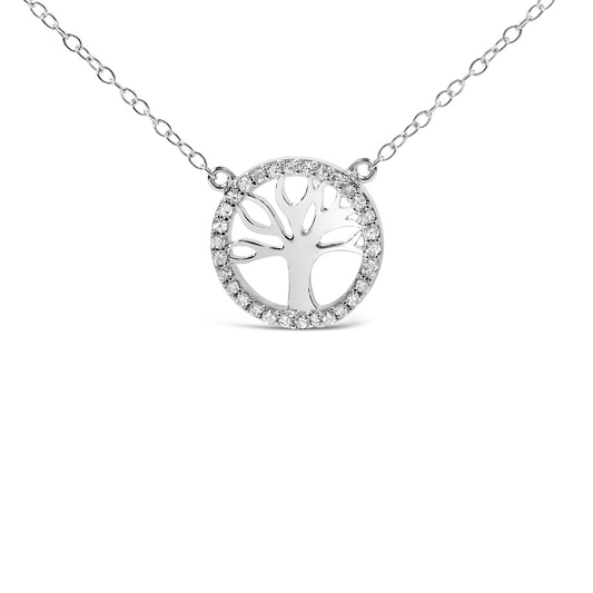 Front-facing shot of white metal necklace with a circular pendant featuring a tree silhouette surrounded by a circle of small round white gemstones in prong settings.