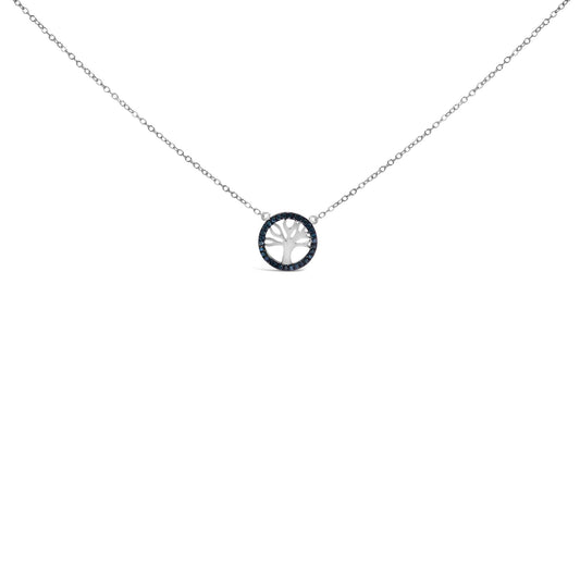 Front-facing shot of a white metal necklace featuring a circular pendant with a tree cutout, surrounded by round blue gemstones in prong settings.