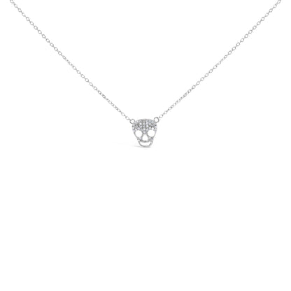 Front view of a white metal necklace with a skull-shaped pendant featuring multiple round white gemstones in a prong setting.