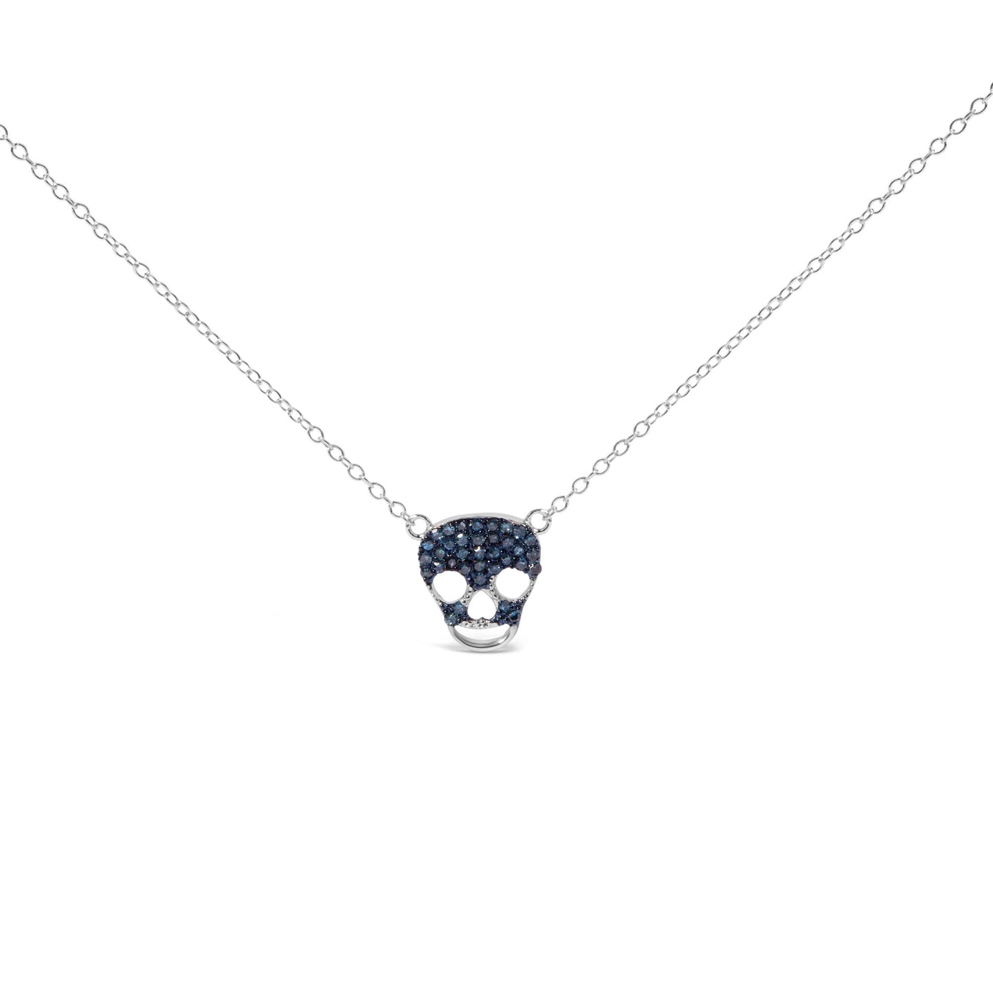 Front angled view of a white metal necklace with a skull-shaped pendant studded with round blue gemstones in a prong setting.