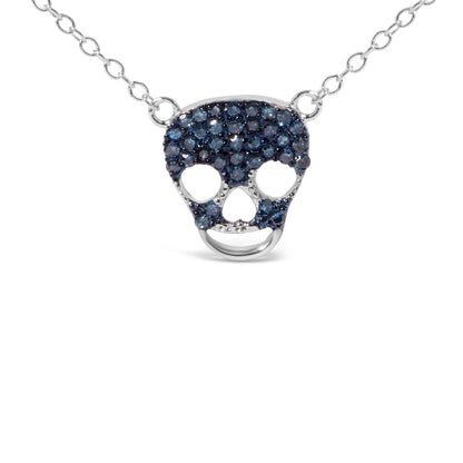 Front view of a white metal necklace with a skull-shaped pendant encrusted with round blue gemstones in a prong setting.