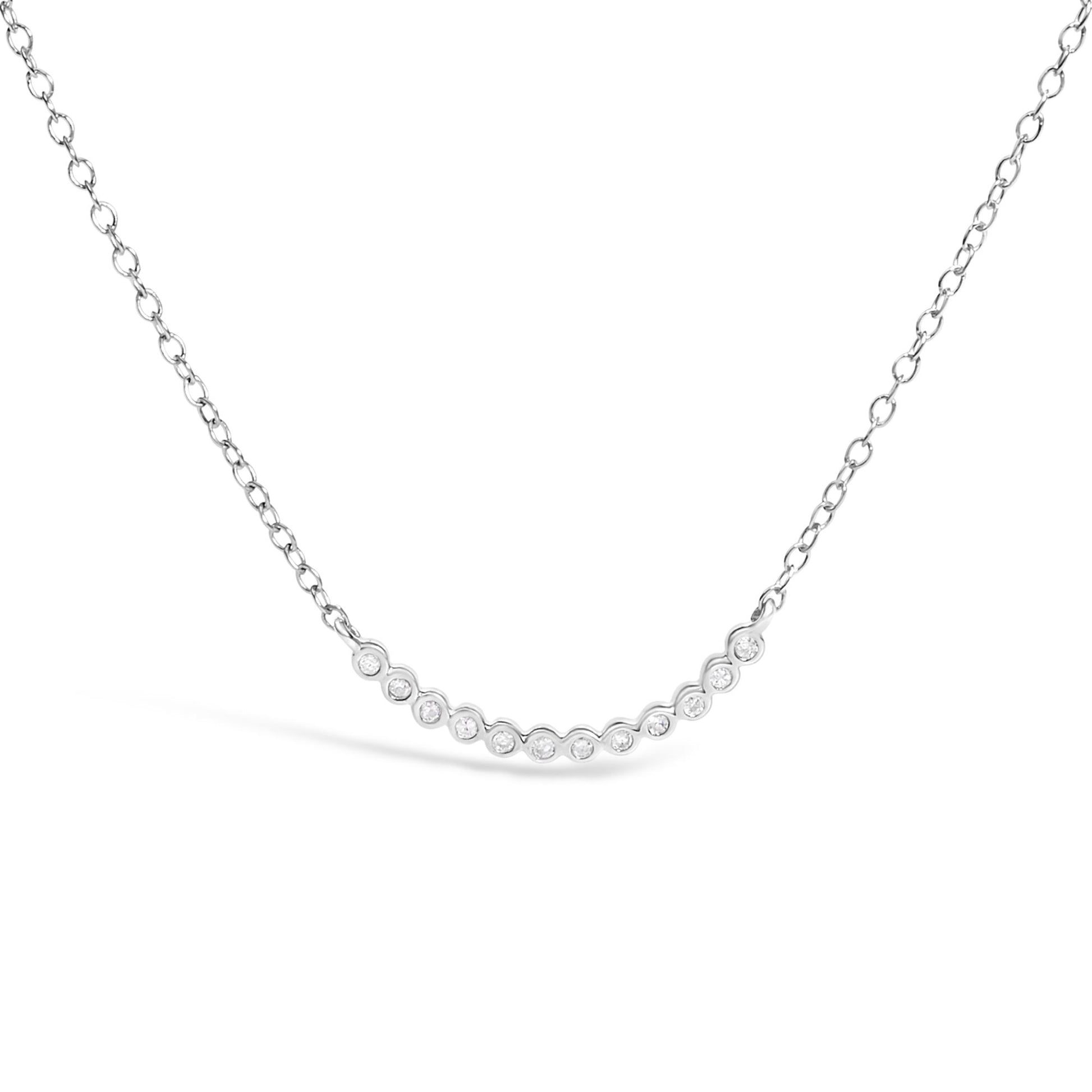 Close-up front view of a white metal necklace with a curved bar pendant set with round white gemstones in prong settings, shown on a white background.
