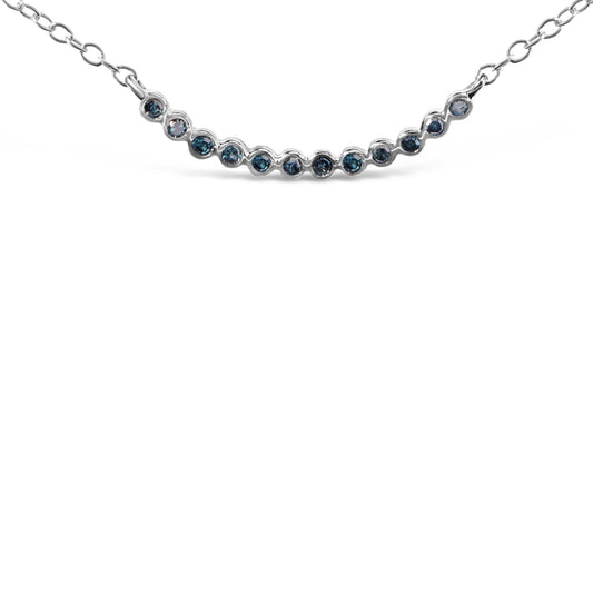 Close-up front view of a white metal necklace featuring a curved row of round blue gemstones set in prongs, shown on a white background.