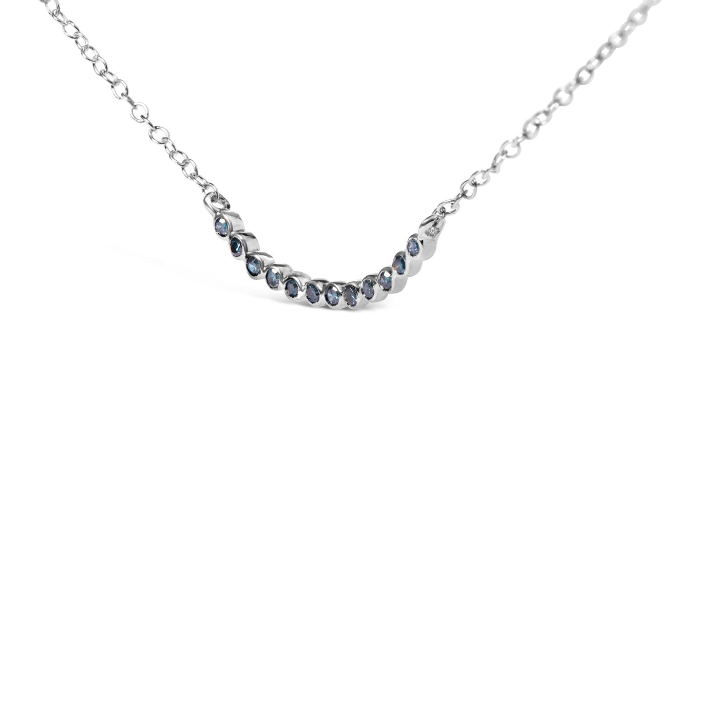 Close-up front angle of a white metal necklace with a curved bar pendant set with evenly spaced round blue gemstones in prong settings.
