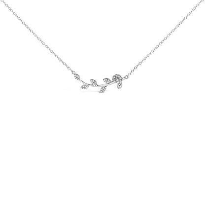Front angle view of a white metal necklace featuring a curved branch design with leaf and flower shapes adorned with round white gemstones in prong settings.