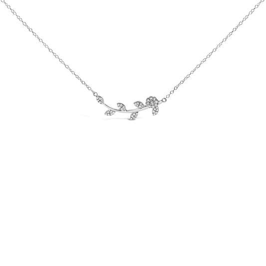 Front angle view of a white metal necklace featuring a curved branch design with leaf and flower shapes adorned with round white gemstones in prong settings.