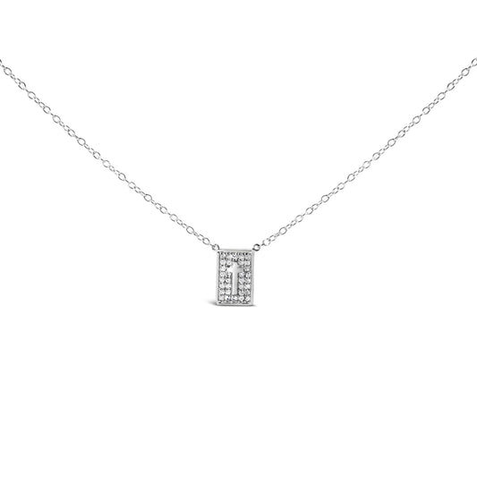 Front-facing shot of a white metal necklace with a rectangular pendant featuring a cross cutout, surrounded by round white gemstones in prong settings.