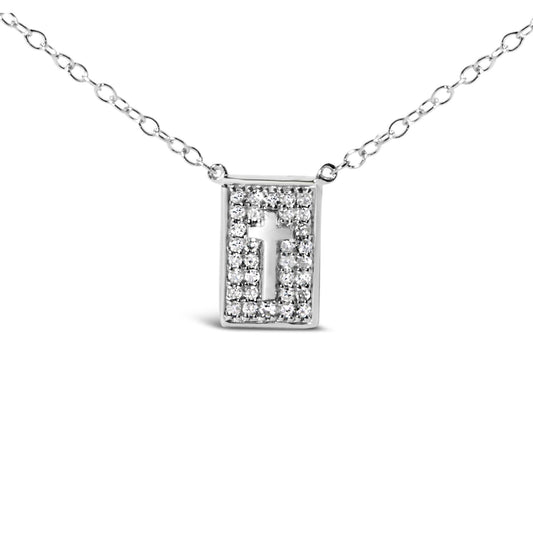 Front-facing shot of a white metal necklace with a rectangular pendant featuring a cutout cross surrounded by round white gemstones in prong settings.