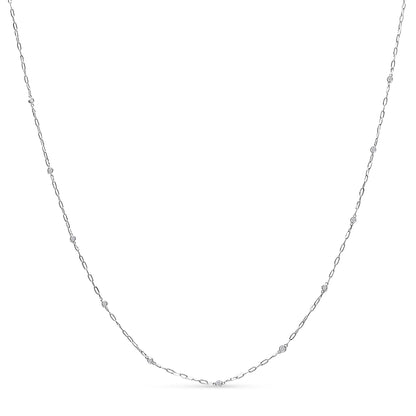 White necklace with a thin chain featuring round white gemstones in bezel settings, shown flat on a white background from the front angle.